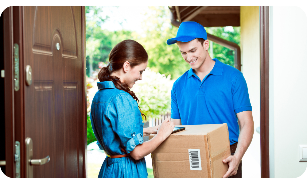 Courier delivering a parcel to a customer at home